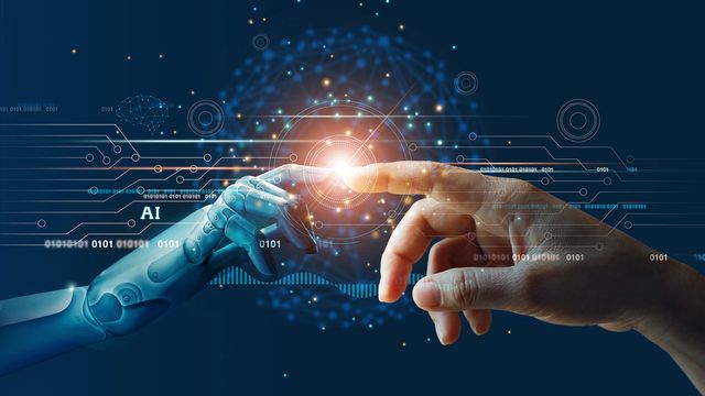 Human and robotic hands with fingertips touching and illuminating, surrounded by an overlay depicting AI. 