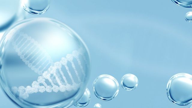 Clear bubbles on blue background with white DNA helix in one. 